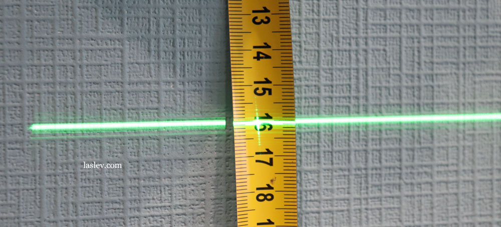 The thickness of the laser line at a distance of 1 meter.