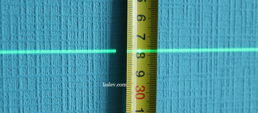 The thickness of the laser line at a distance of 1 meter.